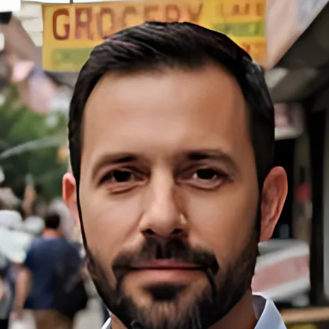 The same face upscaled 4 times, with sharper eyes, hair and beard
